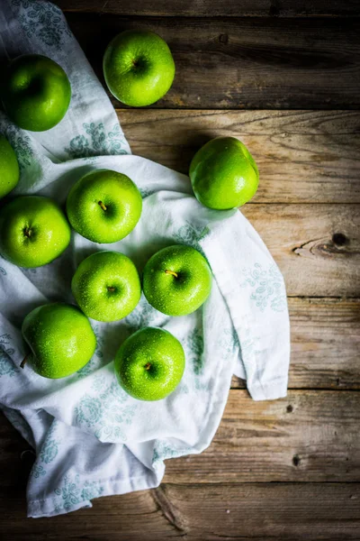 Bright green apples on wooden background — Stock Photo, Image