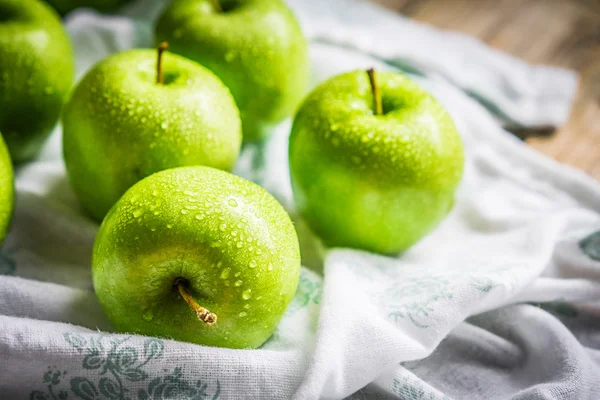 Bright green apples on wooden background — Stock Photo, Image