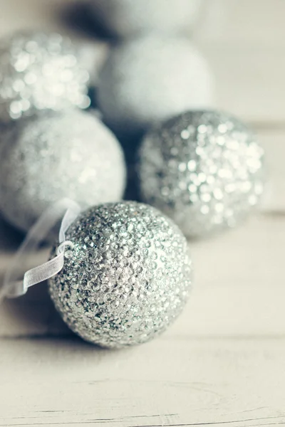 Christmas ornaments on rustic wooden background — Stock Photo, Image