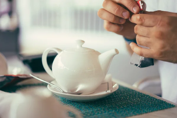 White teapot in the restaurant — Stock Photo, Image