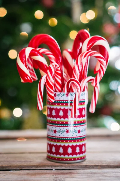 Christmas candy canes on wooden background — Stock Photo, Image