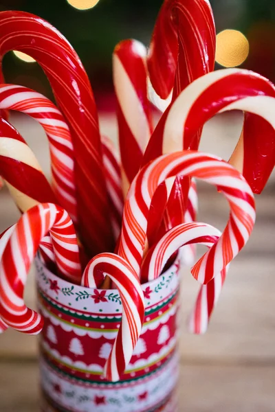 Christmas candy canes on wooden background — Stock Photo, Image