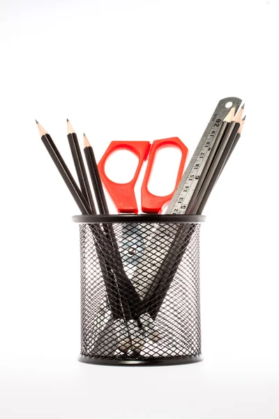 Pencils, ruler and scissors in holder. Isolated on white backgro — Stock Photo, Image