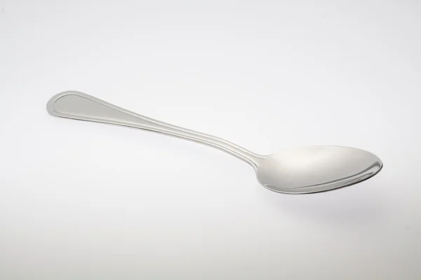 A silver spoon isolated on white background — Stock Photo, Image