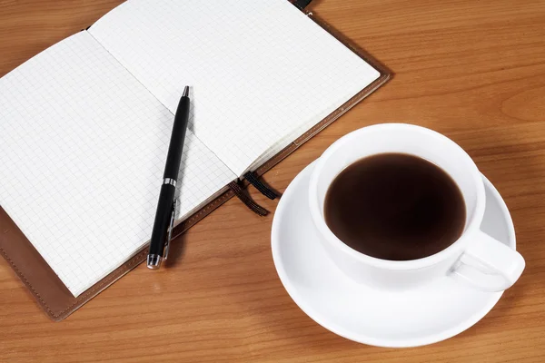 Office desk with coffee cup — Stock Photo, Image