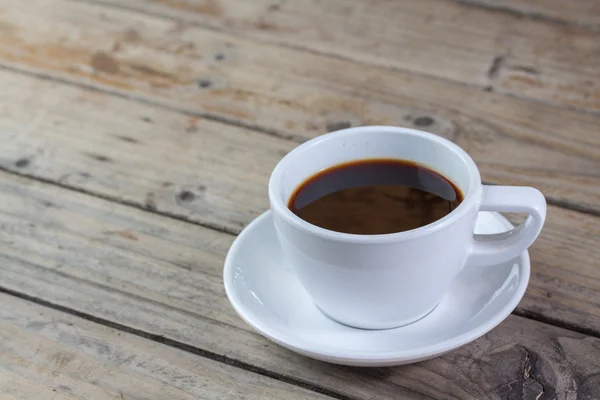 White cup of coffee on wood — Stock Photo, Image