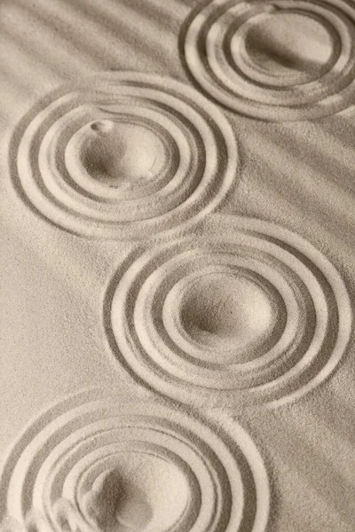 Sand surface texture with circles and shadows, for relaxation and spiritual harmony. Garden of meditation, relaxation, restoration of balance, harmony of spirituality and relaxation