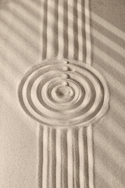 Sand surface texture with circles and shadows, for relaxation and spiritual harmony. Garden of meditation, relaxation, restoration of balance, harmony of spirituality and relaxation