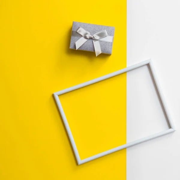 Empty photo frame for text on geometric paper white and yellow colorful background.