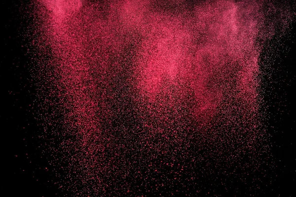 Magenta powder explosion on black background. — Stock Photo, Image