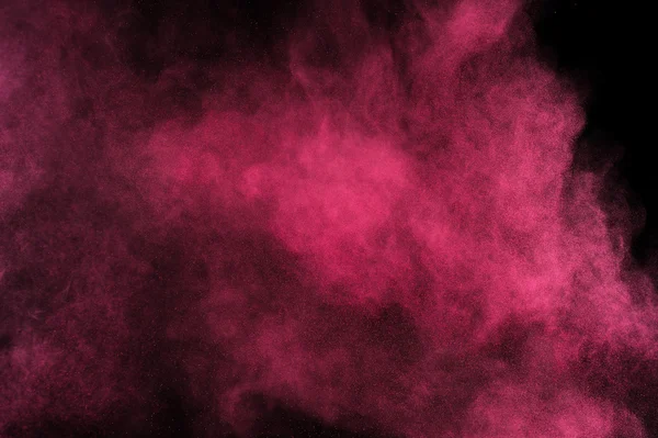 Explosion de poudre Magenta sur fond noir . — Photo