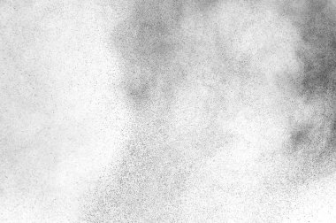 Siyah parçacıklar beyaz zemin üzerinde izole edildi. Soyut toz tabakası dokusu.