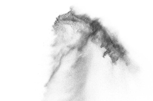 Взрыв черных частиц изолирован на белом фоне. Абстрактная пылевая текстура.