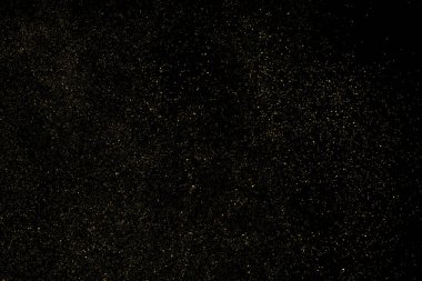 Siyah Arkaplan 'da izole edilmiş altın parıltılı doku. Altın yıldız tozu. Amber Parçacık Rengi. Parıltı Yağmuru. Vektör İllüstrasyonu, Eps 10.