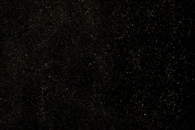 Siyah Arkaplan 'da izole edilmiş altın parıltılı doku. Altın yıldız tozu. Amber Parçacık Rengi. Parıltı Yağmuru. Vektör İllüstrasyonu, Eps 10.
