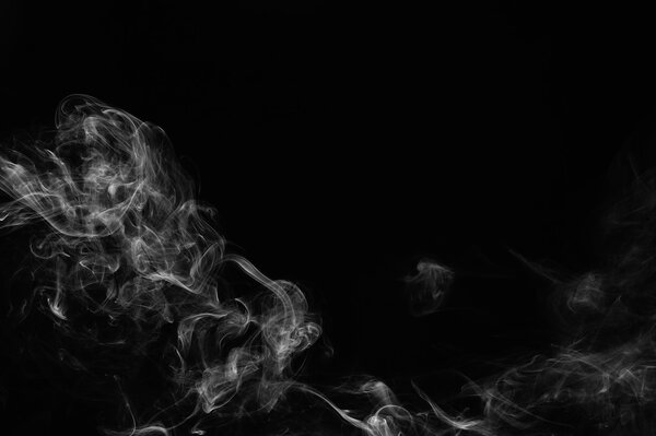 Abstract smoke moves on a black background