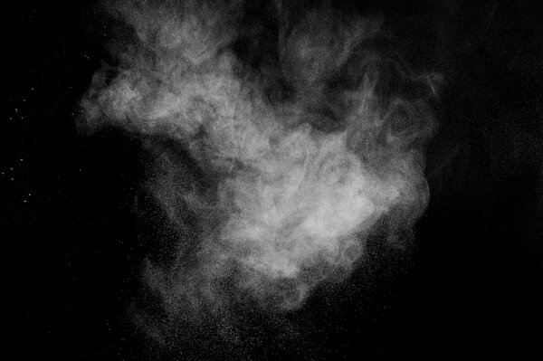 Abstract white dust explosion on a black background. abstract white powder. design elements. abstract texture.