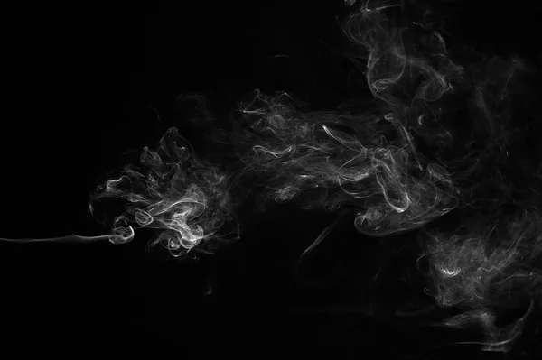 Abstrakt rök på en svart bakgrund. — Stockfoto