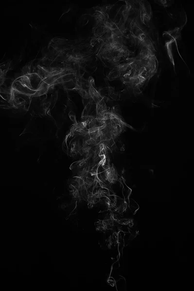 Humo abstracto se mueve sobre un fondo negro. —  Fotos de Stock