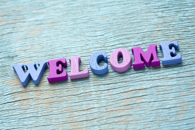 Word vintage ahşap arka plan üzerinde hoş geldiniz