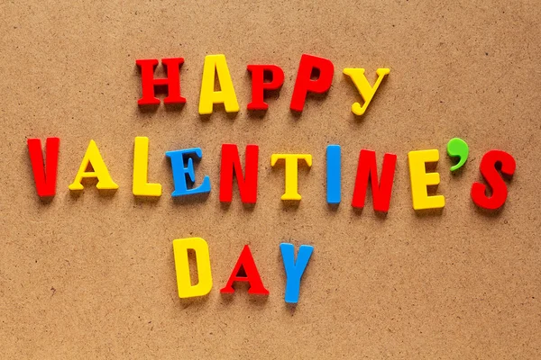 Happy Valentine's Day text on cardboard background — Stock Photo, Image