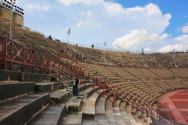Few tourists walking inside Arena di Verona,antique roman amphitheater. Verona,Italy,March 2014 