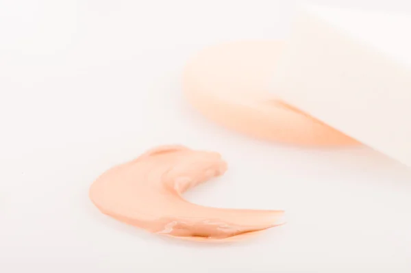 Liquid tinted make-up cream foundation sample stroke and sponges — Stock Photo, Image