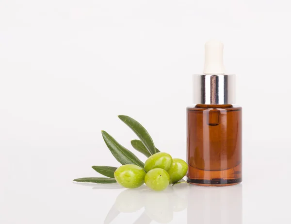 Spa theme - olives and cosmetic oil — Stock Photo, Image