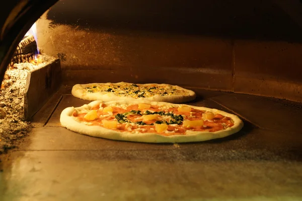 Pizza in the oven — Stock Photo, Image