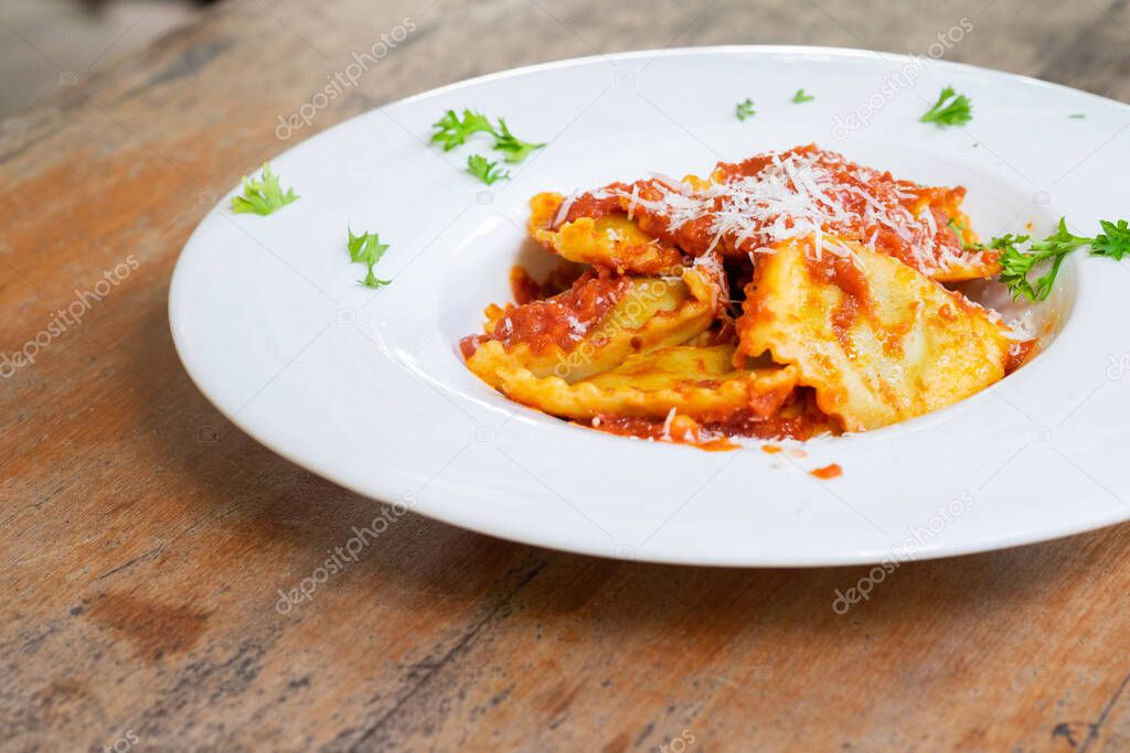 Ravioli with tomato sauce homemade and basil