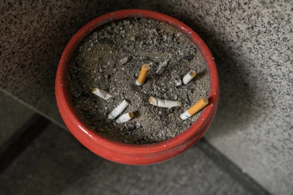 Smoked Cigarettes Butts in a Dirty Ashtray — Stock Photo, Image