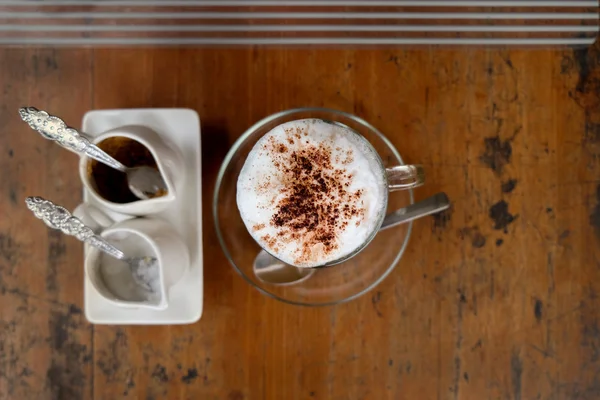 A cup of hot cappuccino and bread — Stock Photo, Image