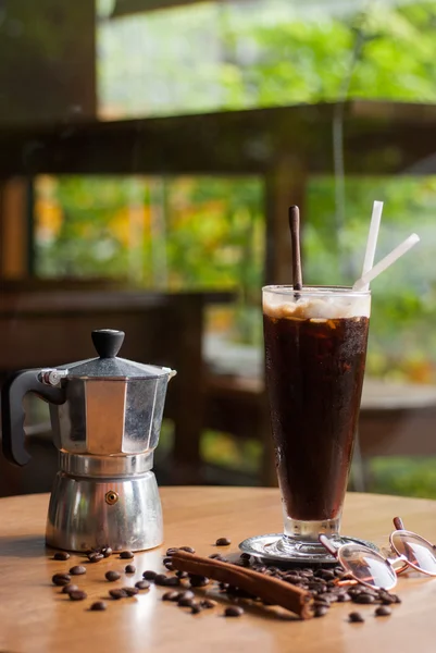 A moka pot and a cup of coffee with roasted coffee beans — Stock Photo, Image