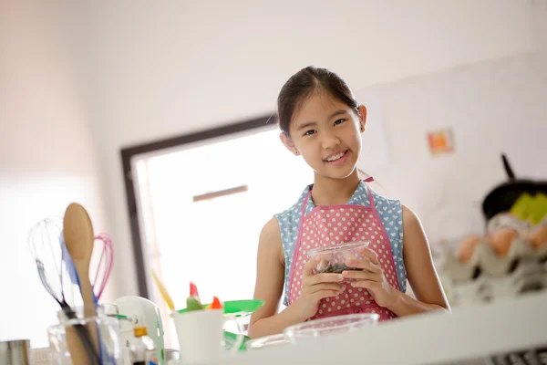 Little Asian cute chef cooking a bakery in kitchen — Stock Photo, Image