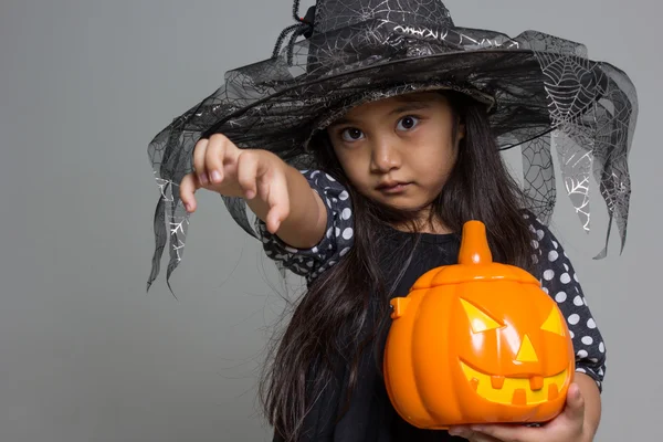 Asian girl with pumpkin — Stock Photo, Image