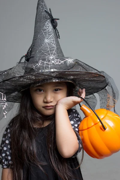 Asian girl with pumpkin — Stock Photo, Image