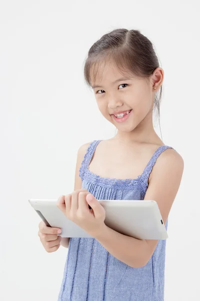 Happy Asian child showing tablet computer — Stock Photo, Image