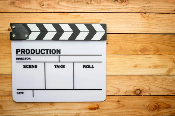 Movie slate film on wooden table — Stock Photo, Image