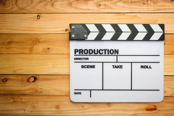 Movie slate film on wooden table — Stock Photo, Image