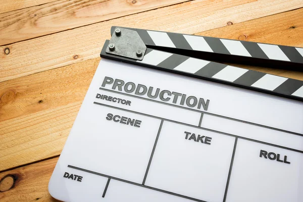 Movie slate film on wooden table — Stock Photo, Image