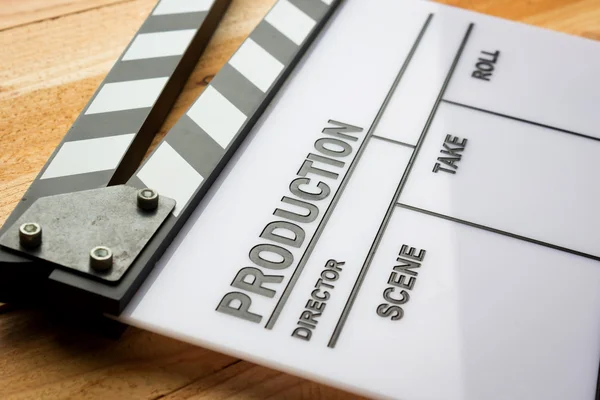 Movie slate film on wooden table — Stock Photo, Image