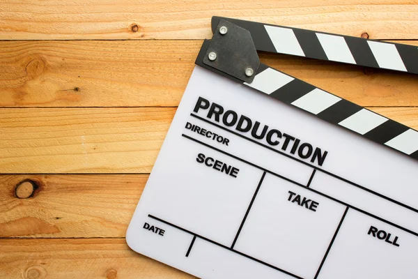 Movie slate film on wooden table — Stock Photo, Image