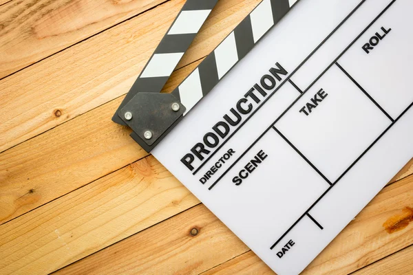 Movie slate film on wooden table — Stock Photo, Image