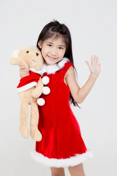 Piros Santa kalap elszigetelt háttér ázsiai kislány portréja — Stock Fotó