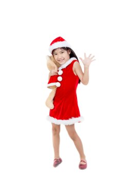 İzole arka plan üzerinde kırmızı Santa şapkalı küçük Asya kız portresi