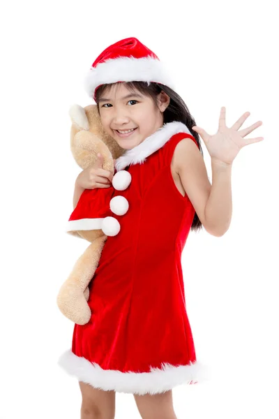 Portrait of little Asian girl in red Santa hat on isolated background — Stock Photo, Image