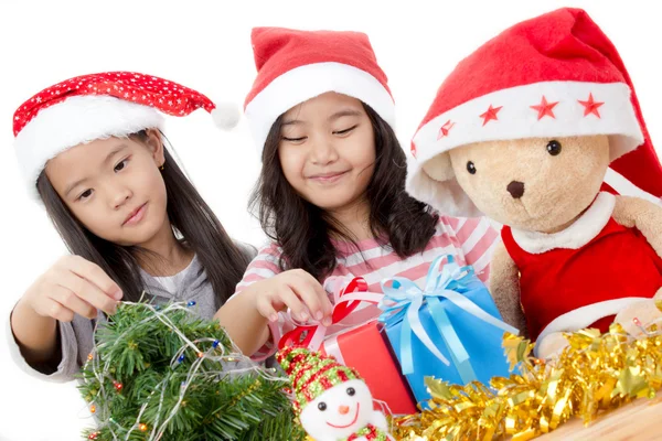 Happy Asian child in Santa hat with Christmas decorations — Stock Photo, Image