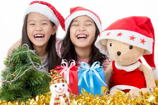 Happy Asian child in Santa hat with Christmas decorations — Stock Photo, Image