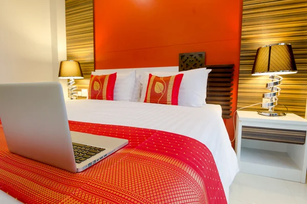 Laptop on the bed — Stock Photo, Image