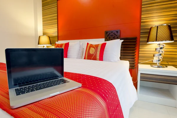 Laptop on the bed — Stock Photo, Image
